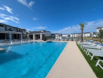 Resort style swimming pool with lap lane and tanning ledge